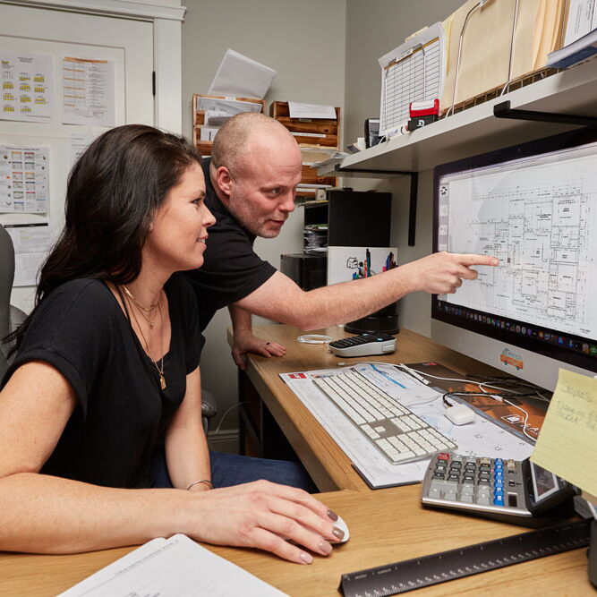 Adam and Ashley reviewing layout specs.
