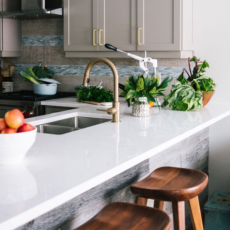 White stone countertop with sink and plants